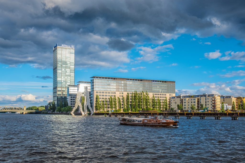 30 m Molecule Man sculpture on the Spree River, Berlin, Germany, in front of the Treptowers.